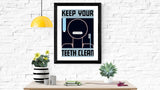 Keep Your Teeth Clean poster framed on wall
